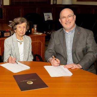 Signing for E. Ray Solomon Family Floor in Legacy Hall