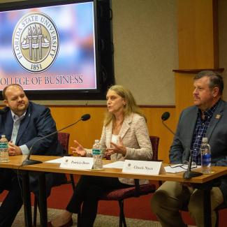 Florida Insurance Commissioner Michael Yaworsky with FSU faculty members Patricia Born and Charles Nyce
