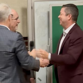 Dean Michael Hartline with BOG member Scott Price and new board chair Jamie Harden