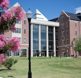 The West entrance of the Herbert Wertheim Center for Business Excellence